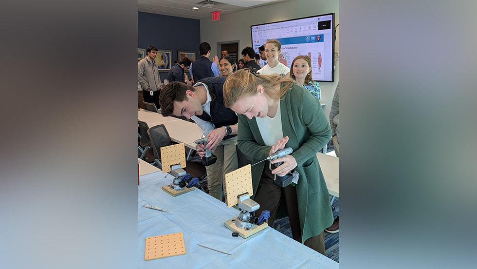people using drills in a workshop setting