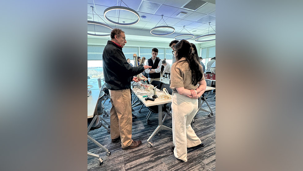instructor speaking to students in a workshop