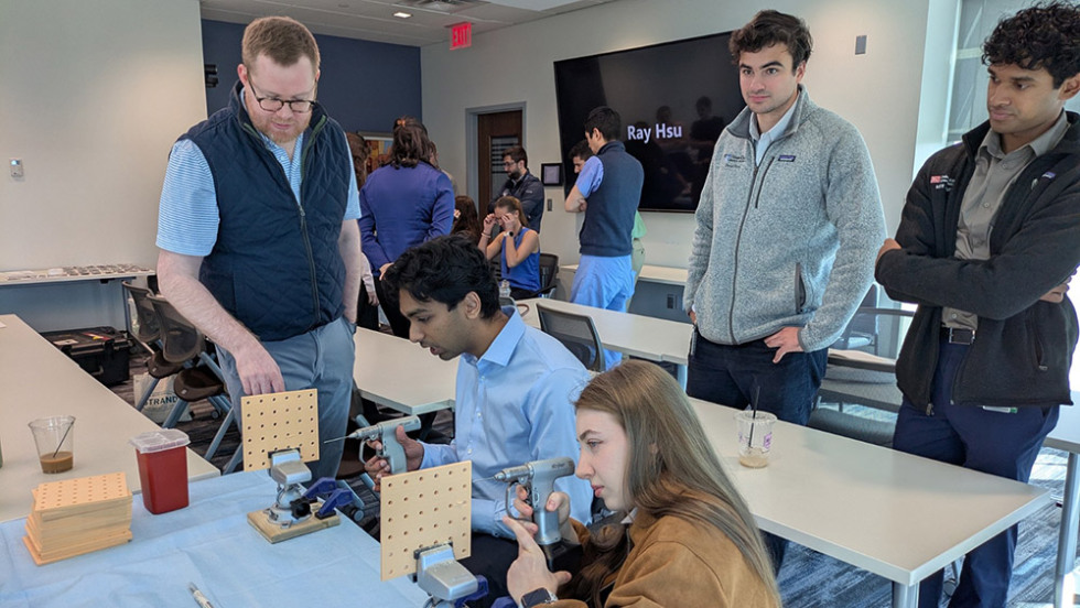 instructor watching students use drills